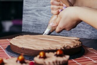a person cutting a cake